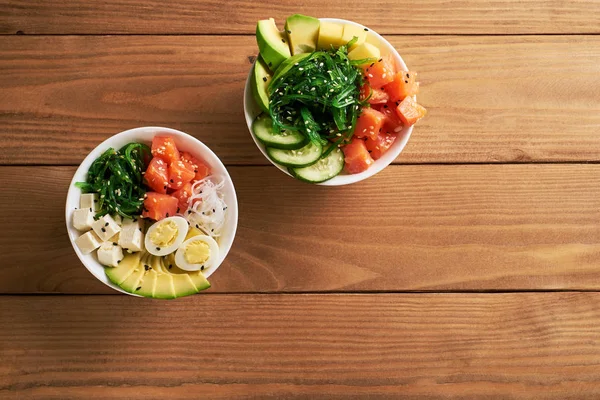 Raw Organic Poke Bowl Rice Avocado Salmon Mango Cucumbers Chuka — Stock Photo, Image