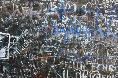 tourists painted the wall in different languages, abstract background for design, wallpaper
