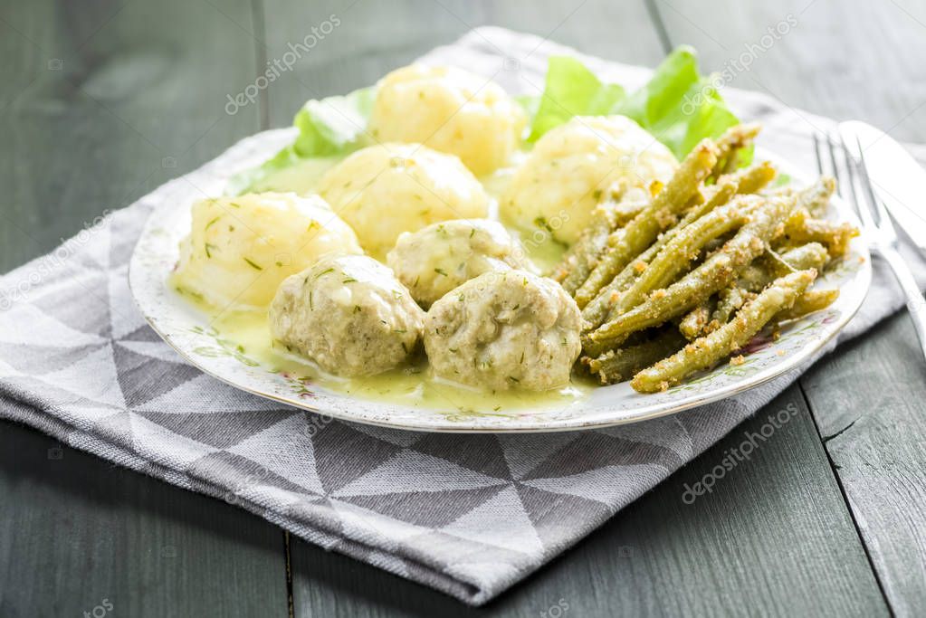 Meatballs in dill sauce with potatoes and green beans
