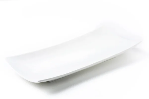Белая прямоугольная пластина — стоковое фото