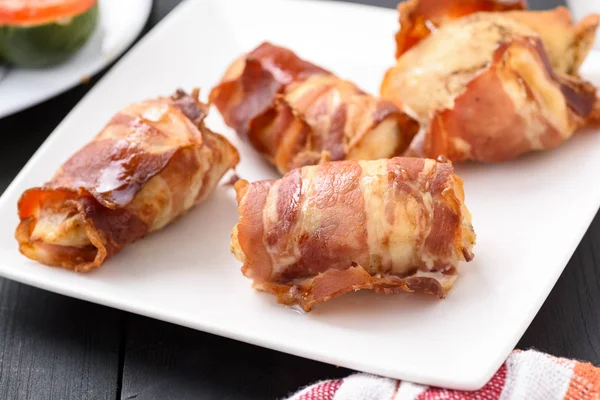 Chicken breast fillet baked in bacon — Stock Photo, Image