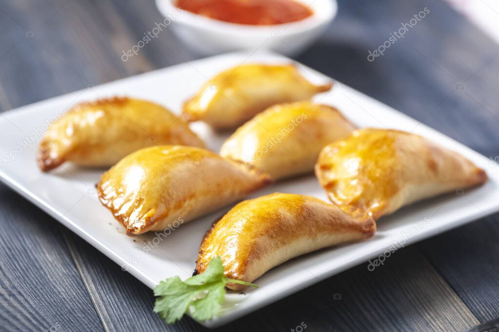 Empanada  -dumplings stuffed with meat and vegetabl