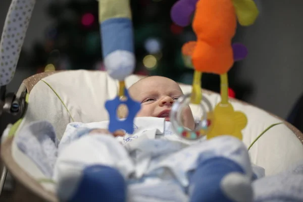 Newborn Funny Baby Lies Playing Toys Cradle Christmas Tree — Stock Photo, Image