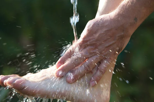 Muslim man washes his hands before prayer ritual cleansing