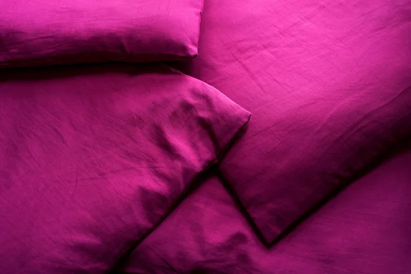 Magenta background. Abstract fabric texture of a saturated purple color