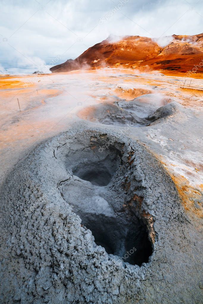 Namafjall - geothermal area in field of Hverir. Landscape which pools of boiling mud and hot springs. Tourist and natural attractions in Iceland