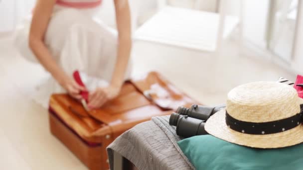 Top View Blonde Woman Hat White Dress Sitting Floor Packing — Stock Video