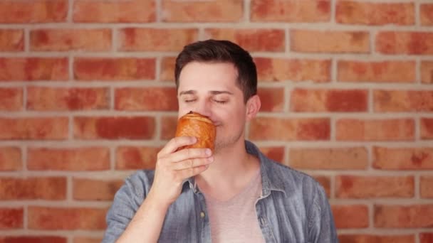 Portrait Man Holding Fresh Bun Enjoying Smell — Stock Video