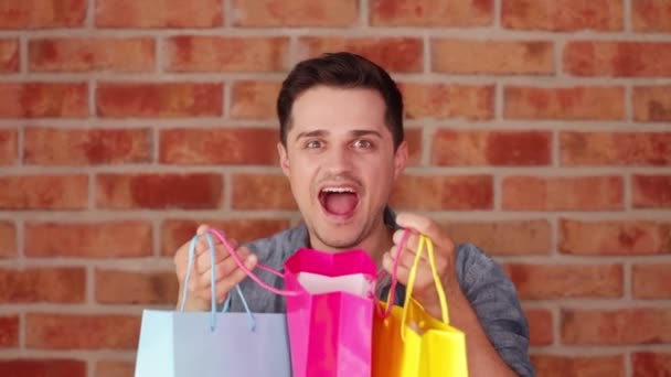 Portrait Man Holding Colourfull Shopping Bags — Stock Video