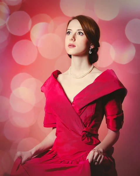 Young redhead woman in red Victorian epoch clothes — Stock Photo, Image