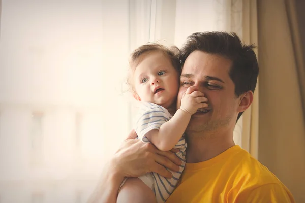 Father playing with a little baby at home. — Stock Photo, Image