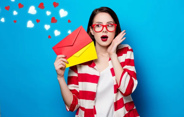 Woman with two envelopes with hearts — Stock Photo, Image