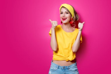 Young redhead girl in yellow clothes clipart
