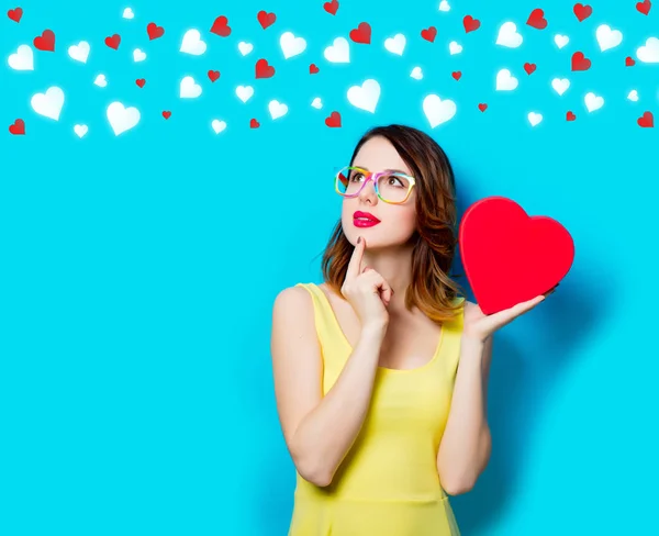 Young woman with box with hearts — Stock Photo, Image
