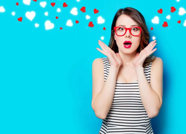 Woman in glasses and abstract hearts — Stock Photo, Image