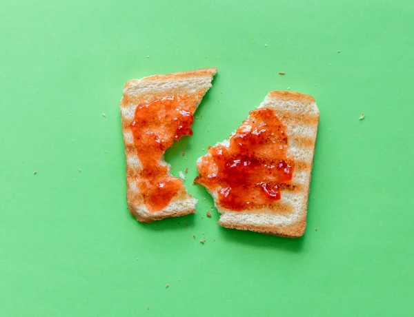 Broken slice of toast bread and jam — Stock Photo, Image
