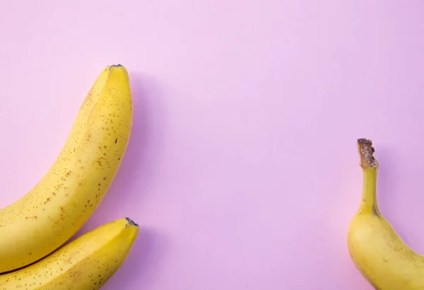 Yellow banana on clear pink background — Stock Photo, Image