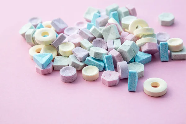 Colorful candies isolated on pink background. — Stock Photo, Image