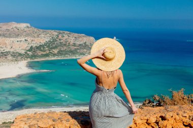 girl in hat and dress with sea coastline clipart