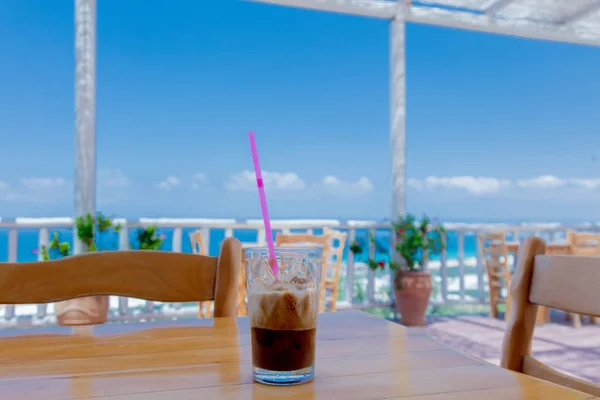 Glass with coffee on a table, Greece — Stock Photo, Image