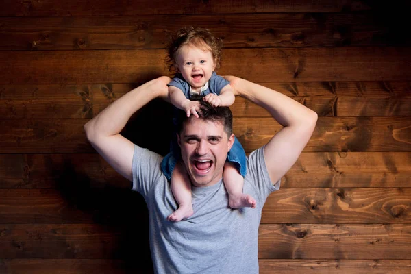 Young happy father and child on shoulders — Stock Photo, Image