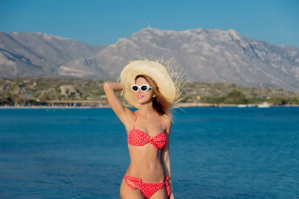 Girl in hat and bikini on Elafonissi beach — Stock Photo, Image