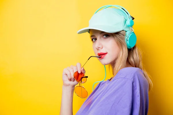 Young Stylish Woman Orange Glasses Headphones Yellow Background Clothes 1980S — Stock Photo, Image