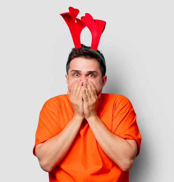 Young Handsome Man Orange Shirt Christmas Deer Horns Studio Image — Stock Photo, Image