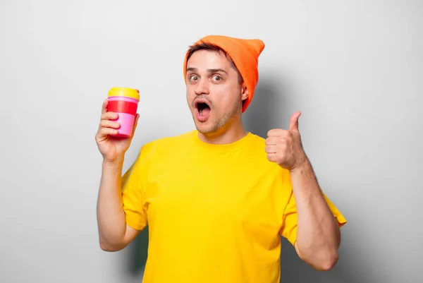 Young Handsome Man Yellow Shirt Orange Hat Cup Coffee White — Stock Photo, Image