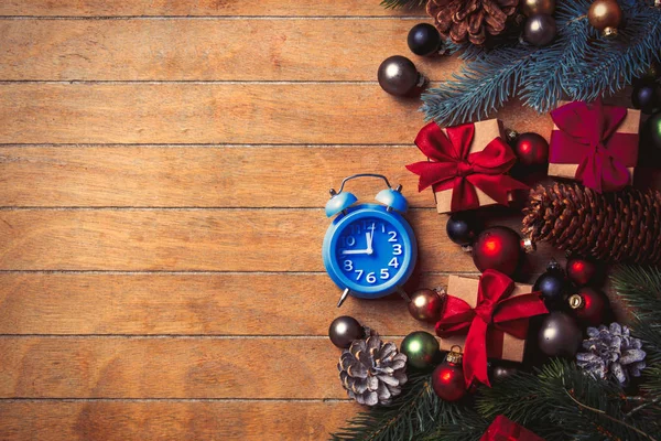 Alarm clock with Christmas decoration — Stock Photo, Image