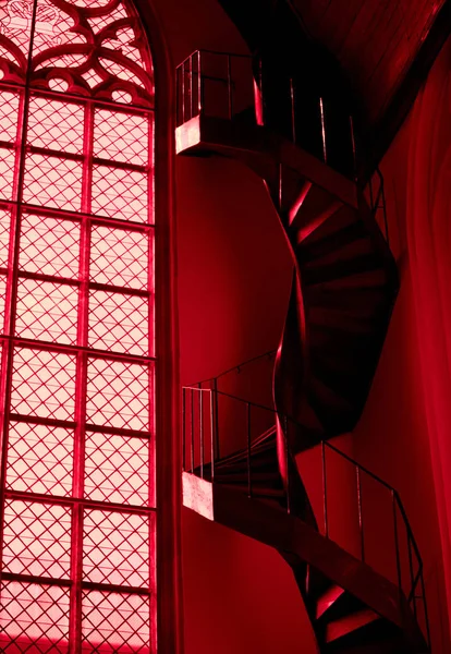 Spiral staircase and window in red church in Amsterdam — Stock Photo, Image