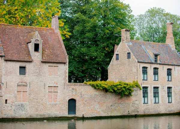 Old medieval houses near a river, fall season — Stock Photo, Image