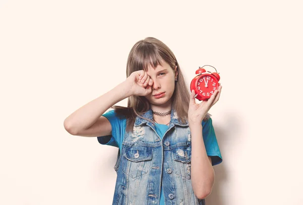 Young teenage girl with alarm clock — Stock Photo, Image