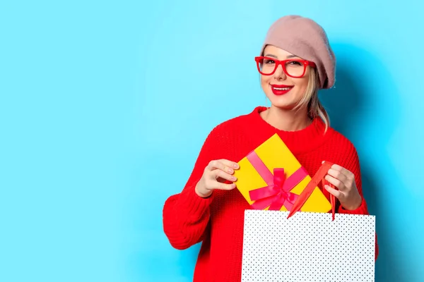 Portrait Young Girl Red Sweater Gift Box Shopping Bag Blue — Stock Photo, Image