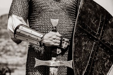 Knight man holding sword and shield. Image in black and white color style clipart