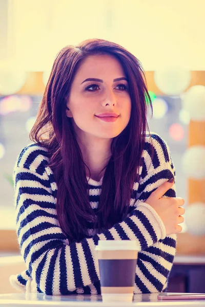 Portrait of young woman with cup of coffee — Stock Photo, Image