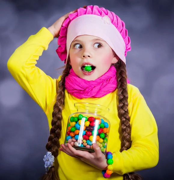 Little girl with jelly bean. — Stock Photo, Image