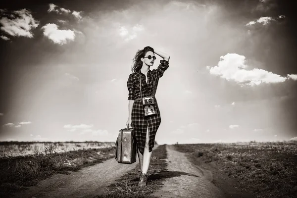 Girl with bag and retro camera — Stock Photo, Image