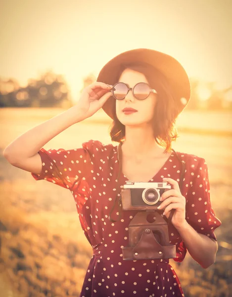 Young woman with camera — Stock Photo, Image