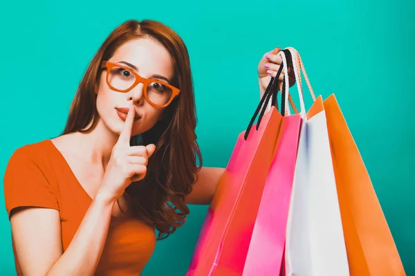 Redhead Girl Shopping Bags Blue Background — Stock Photo, Image