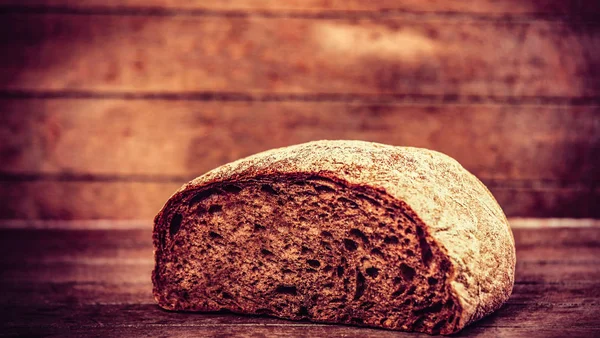 Delicious bread on a wood table — Stock Photo, Image