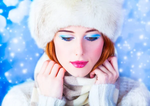 Redhead girl with makeup in fur hat and white scarf — Stock Photo, Image