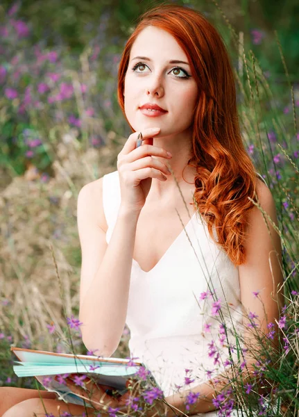 Style redhead girl in white dress with notebook — Stock Photo, Image