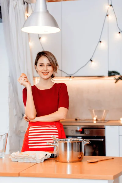 Young Housewife Preparing Christmas Dinner Kitchen Red Apron — Stock Photo, Image