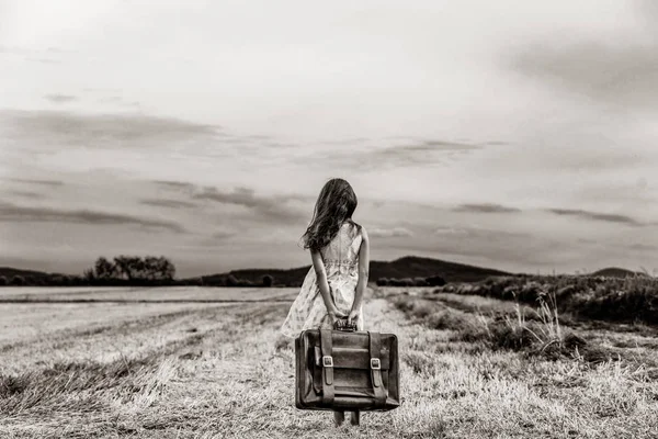 Little girl in classic dress with travel suitcase — Stock Photo, Image