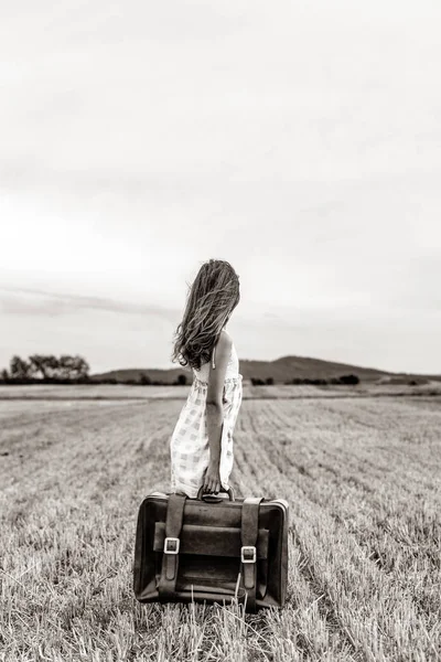Little girl in classic dress with travel suitcase — Stock Photo, Image