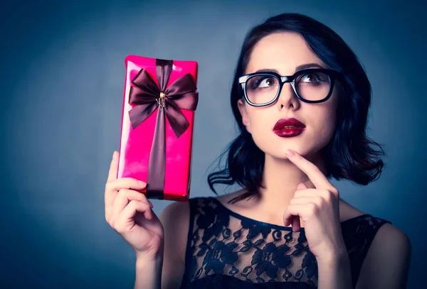 Young woman with gift — Stock Photo, Image