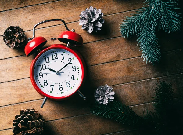 Red Christmas Alarm Clock Pine Cones Branches Wooden Background — Stock Photo, Image