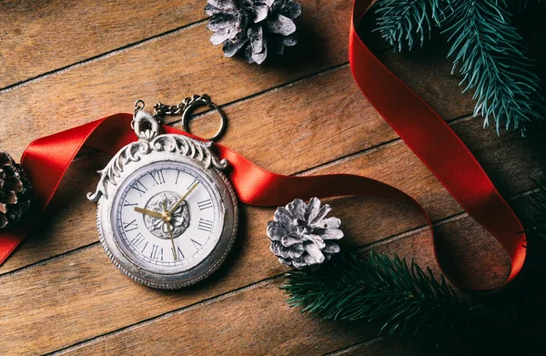 Old victorian watch with bow and cones — Stock Photo, Image