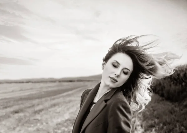 Woman shake head in coat at countryside — Stock Photo, Image